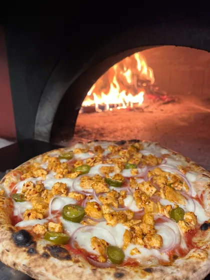 Our chicken and jalapeño pizza, ready to be fired up. The combination of spicy and savoury is a definite crowd-pleaser.