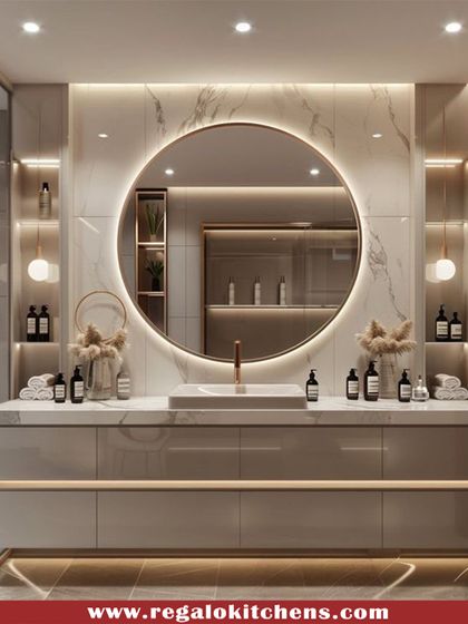 This vanity is a showstopper, featuring a backlit circular mirror against a marble wall. The floating design of the cabinet enhances the sense of space and luxury.