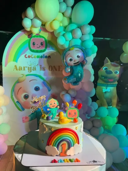Our Cocomelon cake fitting in perfectly with the party's amazing decorations. It's always great to see our creations in a full party setup.