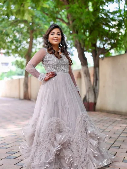 Another full-length shot showing the beautiful movement of the gown. The makeup and hair are designed to complement this dreamy, ethereal look.
