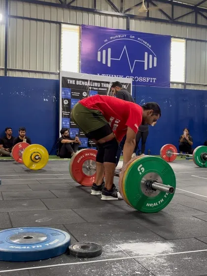 An athlete sets up for a heavy deadlift, a key component of many of our competition workouts.