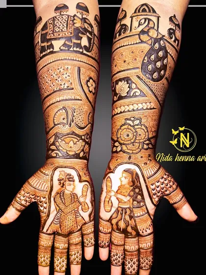 A bridal concept that combines a Varmala ceremony portrait with elephant and peacock motifs on the arms.