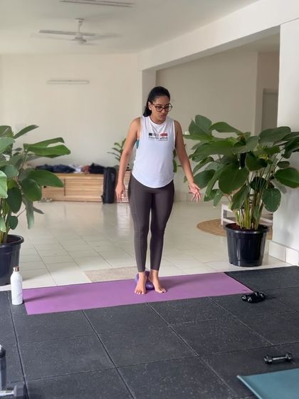 Me demonstrating proper standing alignment at the start of a class. We always begin with grounding ourselves and focusing on posture before we dive into the workout.