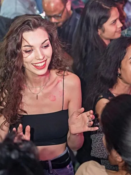 A happy crowd dancing and celebrating love on Valentine's Day.