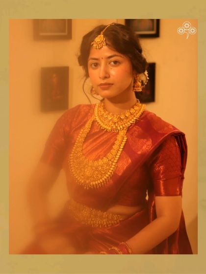 A beautiful model showcasing a full South Indian temple jewellery set, perfect for a silk saree.
