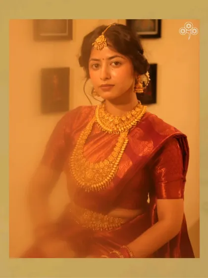 A beautiful model showcasing a full South Indian temple jewellery set, perfect for a silk saree.