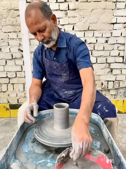 Me at my wheel, finding the center. This is my happy place, where my hands and the clay do the talking. Every piece, big or small, starts with this focused moment.