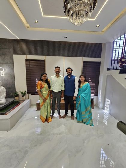 A photo with our clients, Mr. and Mrs. Shreyas, inside their beautiful new villa. It was a pleasure to bring their vision for a contemporary and serene home to life.