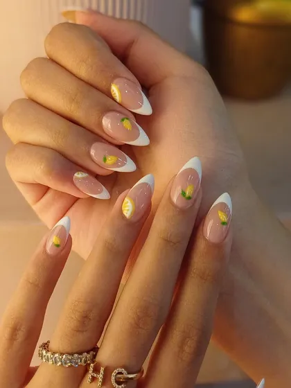 A closer look at the juicy, hand-painted lemon details that make this French manicure perfect for summer.