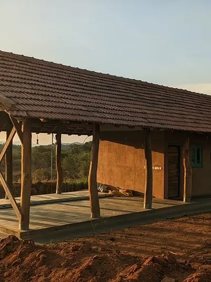 The Unnathi Farm pavilion near Magadi, built as a rustic retreat for a young family. The entire structure was built using natural and recycled materials, with a large veranda for farm life.