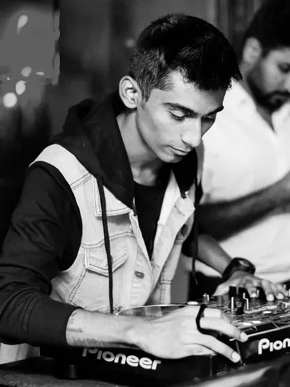 A quiet moment of focus before the beat drops. It's all about timing and feeling the rhythm of the room.