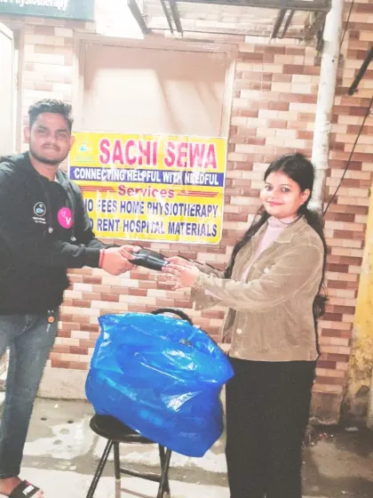 Another shot of our team distributing mufflers, with the *Sachi Sewa* banner proudly displayed. We are committed to being a consistent source of support.