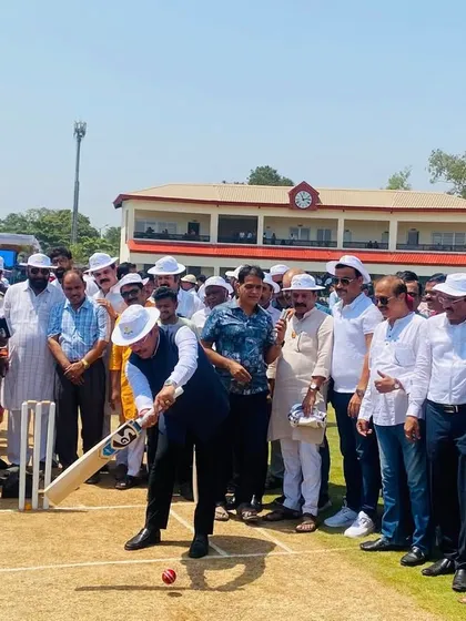A dignitary plays a shot during the opening ceremony, symbolizing the start of a new innings for cricket in Panvel.