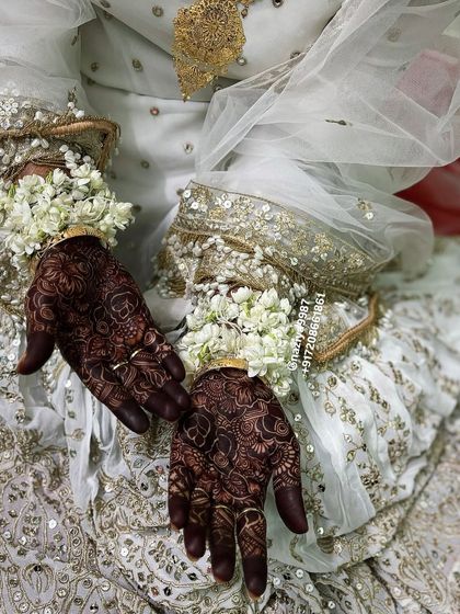 Another view of the bride's nikah look, showcasing her henna.