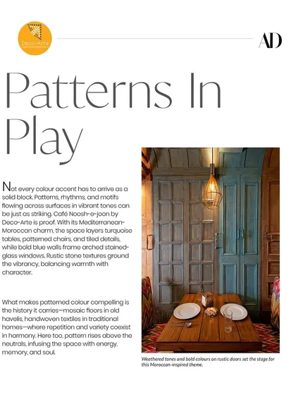 Our design for Café Noosh-e-Joon was featured in Architectural Digest for its "Patterns In Play." The Mediterranean-Moroccan charm shines through with layered turquoise, patterned chairs, and rustic stone textures.