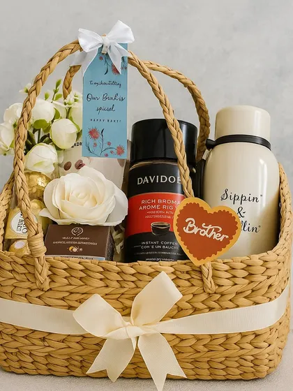 Here’s the perfect Rakhi gift for your favorite brother. This thoughtful basket includes a "Sippin' & Chillin'" stainless steel bottle, rich Davidoff coffee, Ferrero Rocher chocolates, and grooming essentials from The Man Company, all ready to make his day.