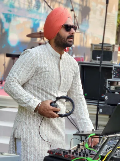 Taking a moment between tracks, always focused on what the crowd needs next.