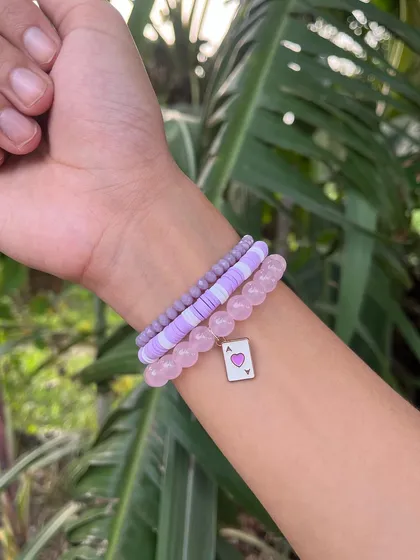 This lavender and pink bracelet stack is so dreamy. It combines clay beads with stone beads and a cute 'ace of hearts' charm, making it a lovely small gift or hamper filler.