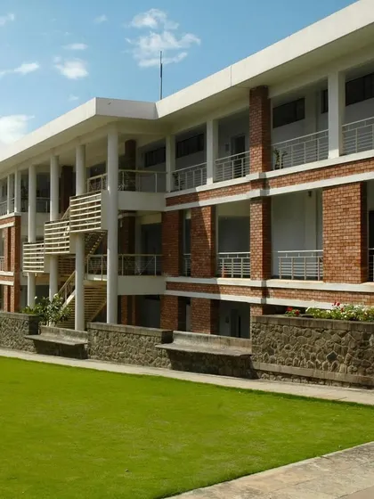 The academic buildings at Symbiosis International University feature single-loaded corridors and deep overhangs. This climate-responsive design maximizes natural light and ventilation while providing shaded, comfortable spaces for students.