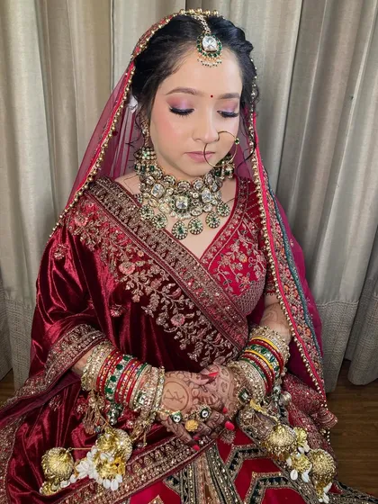My bride Komal, looking absolutely radiant. I used soft purple and pink tones on her eyes to complement her beautiful velvet lehenga.