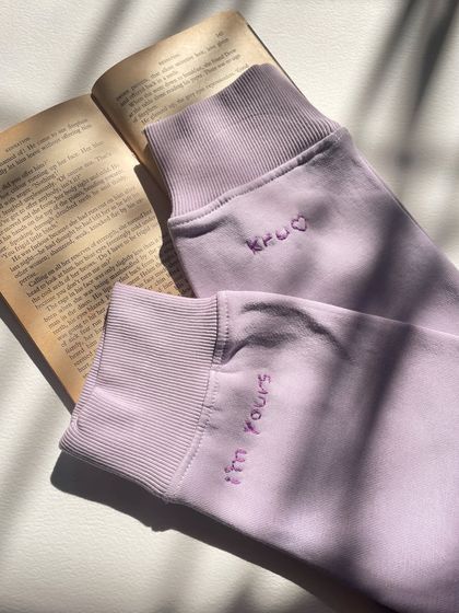 The aesthetic of a personal message. The custom cuff embroidery looks so beautiful against the backdrop of a book.