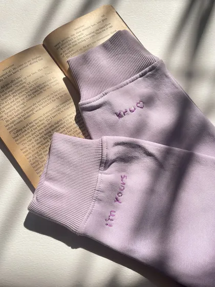 The aesthetic of a personal message. The custom cuff embroidery looks so beautiful against the backdrop of a book.