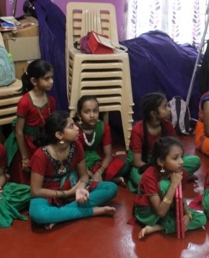 Little ones eagerly waiting for their turn to practice. Their patience and excitement are adorable.