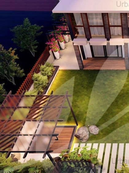 An aerial view of a proposed backyard design for a villa in Gurgaon. The layout includes a pergola-covered seating area, a well-manicured lawn, and pathways that connect different zones of the garden.