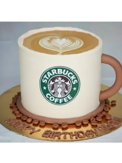 For the coffee lover, I created this Starbucks cup-shaped cake. It's a chocolate coffee mousse flavor, complete with latte art on top and edible coffee beans.