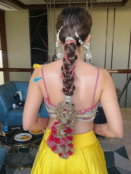 The intricate details of the hair accessory. Every element comes together to create a stunning and memorable Haldi look.