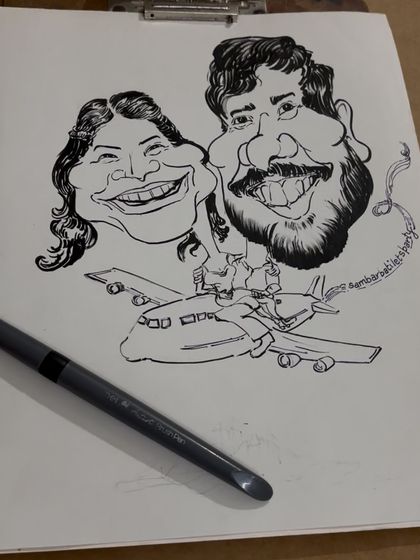 The initial sketch for the travel-loving couple. This black and white drawing shows the composition and expressions before I bring the scene to life with vibrant watercolors.