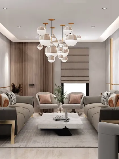 This symmetrical arrangement of sofas and chairs creates a balanced and inviting conversation area. The design uses a mix of textures and a large area rug to ground the space.