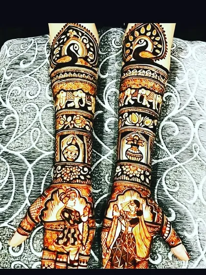 A stunning full-coverage design featuring peacocks, elephants, and bride-groom figures. This is a popular choice for a grand bridal look.
