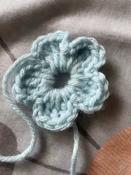 A sweet little flower made by a beginner. This project is great for practicing basic stitches and learning how to work in the round.