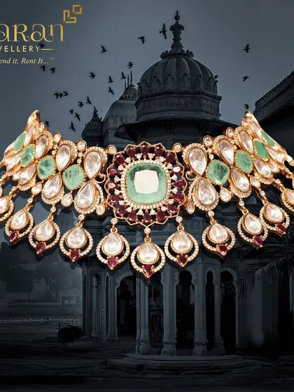 A breathtaking choker necklace featuring large polki stones, surrounded by emeralds and rubies. This is a true statement piece, reflecting the royal heritage of Indian jewellery design.