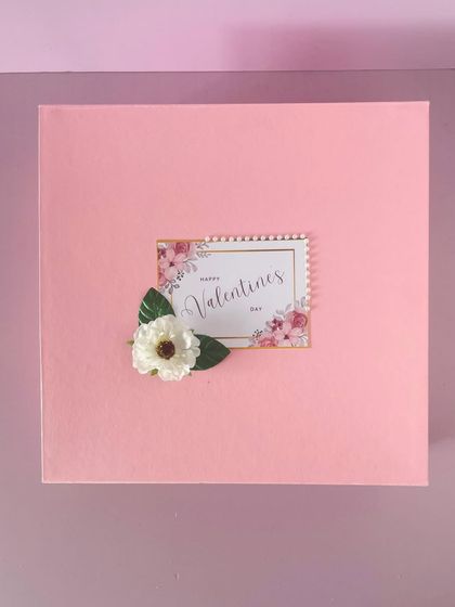 A beautiful pink box for Valentine's Day. The custom tag and delicate flower make for a very romantic presentation.