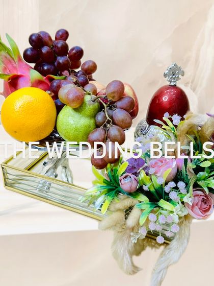 A simple yet elegant Diwali gift. This tray features fresh fruits and a beautifully decorated jar, perfect for healthy festive gifting.