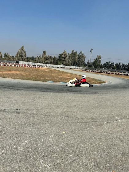 A young driver in a micro-max kart during a pre-season test. We provide advanced coaching for all age categories, helping our youngest talents prepare for national level competition.