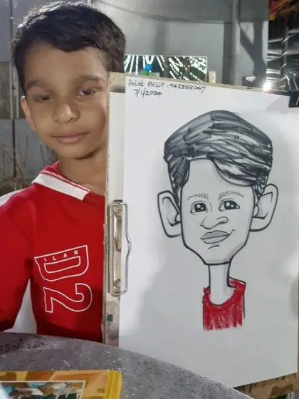 This young boy was a great model for his caricature. It was a pleasure to draw for him and his family.