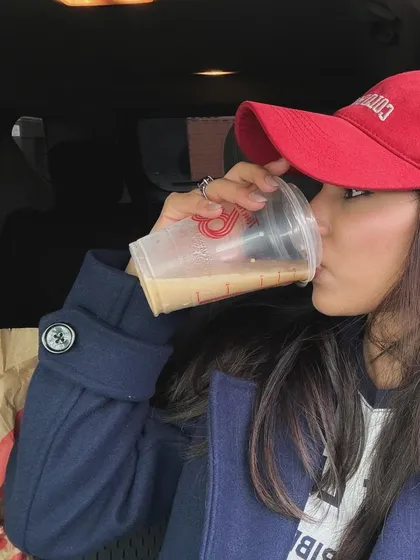 A close-up of the coffee-drinking moment.