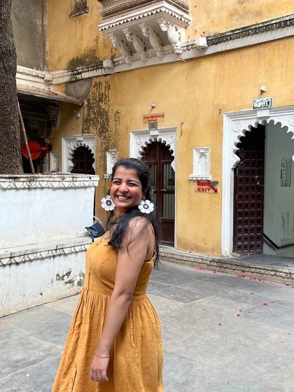 Here I am, styling my own creation! I wore these large floral earrings on a trip, and they were so comfortable and eye-catching. It's the best feeling to wear something you've poured your heart into.