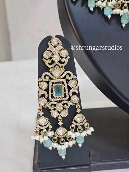 A close-up of the earring from the popular mint green AD bridal set, showing the beautiful craftsmanship.