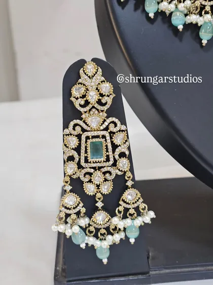 A close-up of the earring from the popular mint green AD bridal set, showing the beautiful craftsmanship.