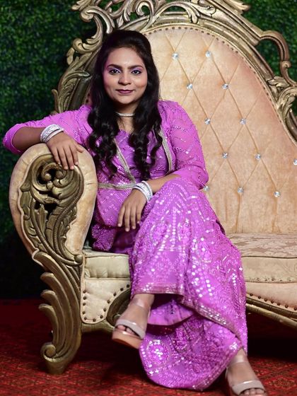 A confident pose from my client in her custom purple sharara suit. The intricate embroidery and rich color make it a standout piece for any celebration.