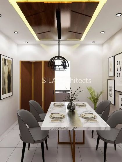 A dining room concept with a marble-top table and a dark wood false ceiling, creating an intimate and stylish space for meals.