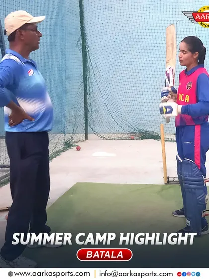 A coach provides batting tips to a female cricketer in the nets during the summer camp. We focus on personalized feedback.