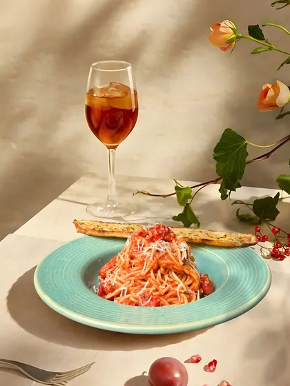A perfect pairing: my spaghetti with a rich tomato sauce and a glass of iced tea. This is what I call a moment of pure indulgence.