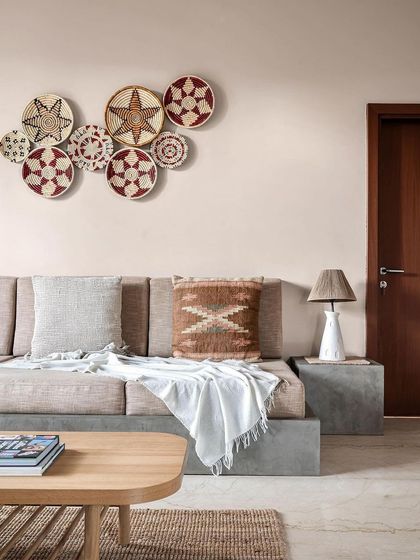 Another image from the India Today Home feature, showing the family room's custom concrete seating and earthy, boho decor. This space was designed to be a cozy and inviting retreat.