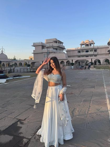 Another angle of the white and silver lehenga, showcasing its movement and how it catches the light.