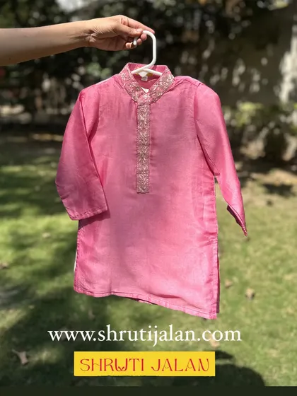 A classic pink kurta for boys with a beautifully embroidered neckline. Simple, elegant, and comfortable.